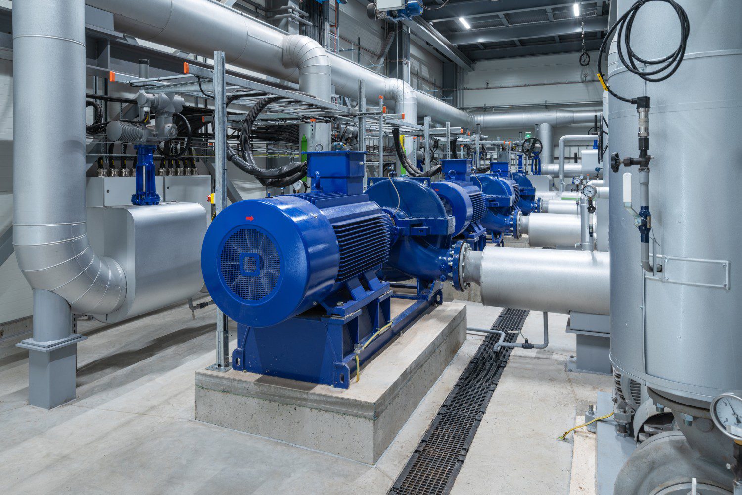 Industrial machinery with blue motors and pipes.