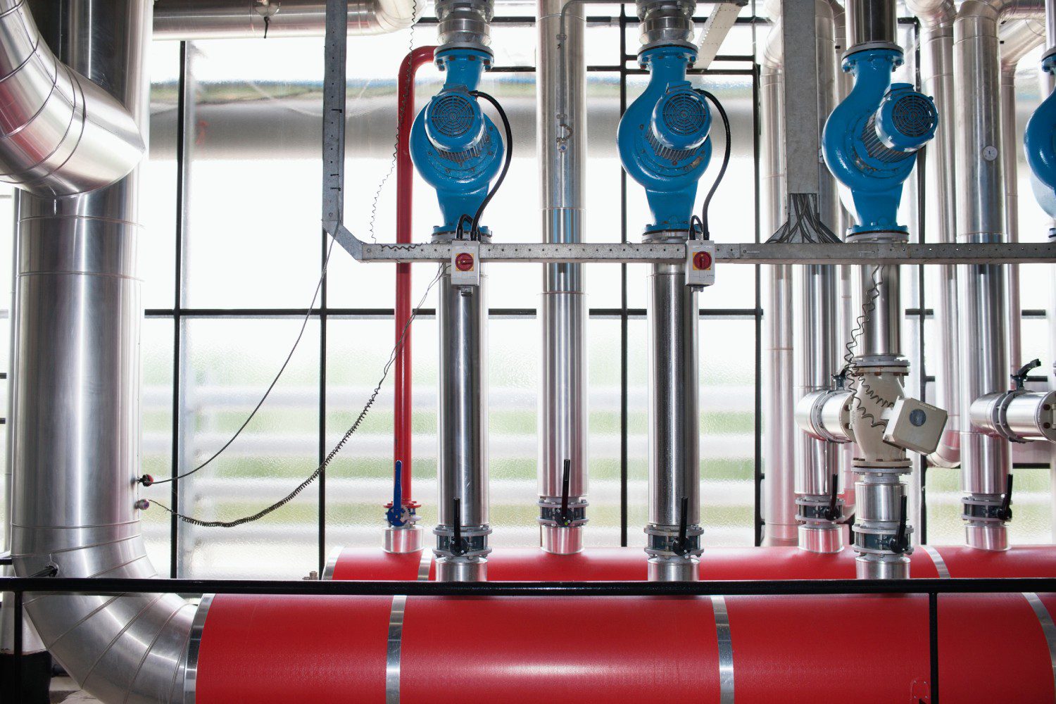 Industrial pipes and valves in a facility.