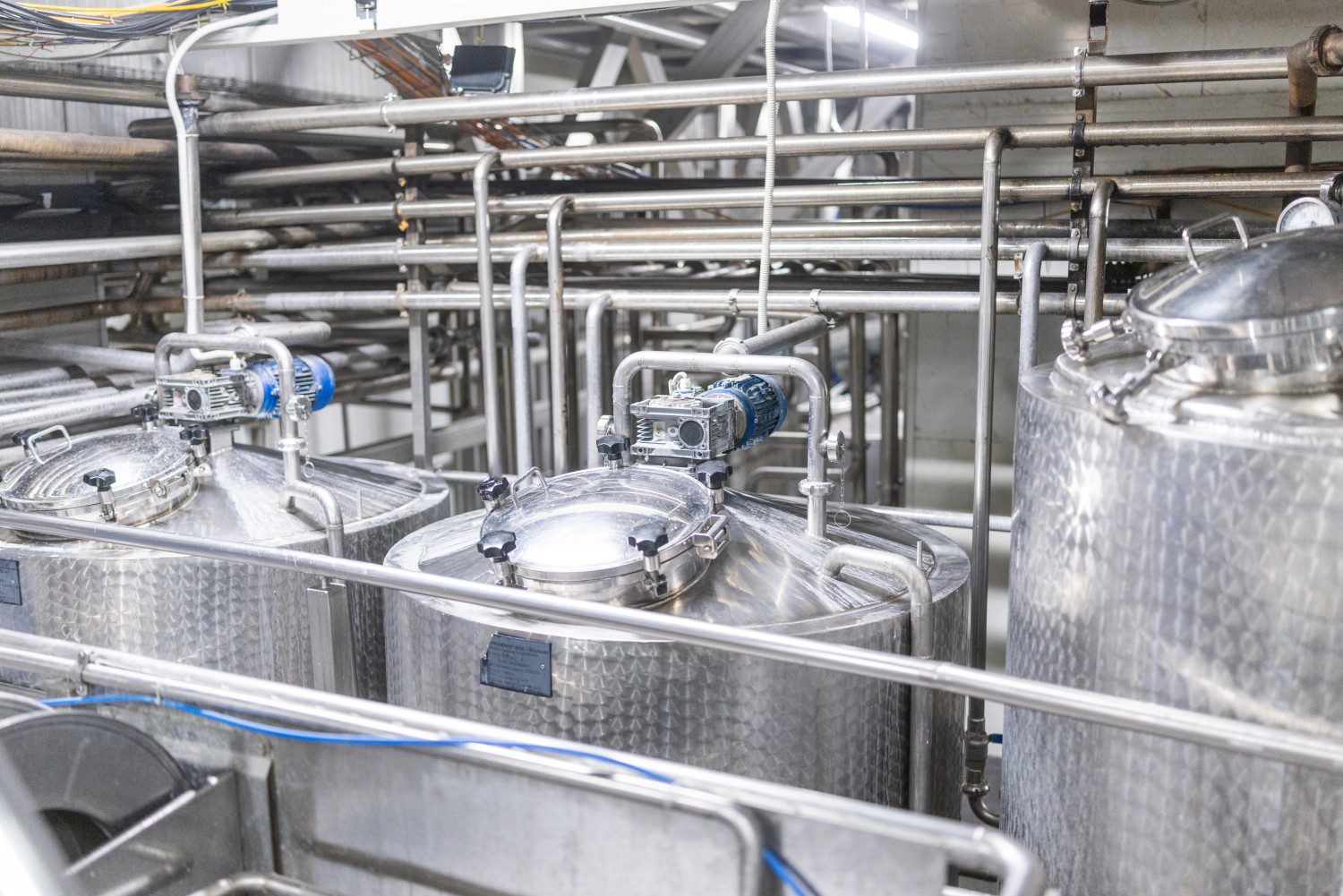 Industrial stainless steel tanks and pipes.