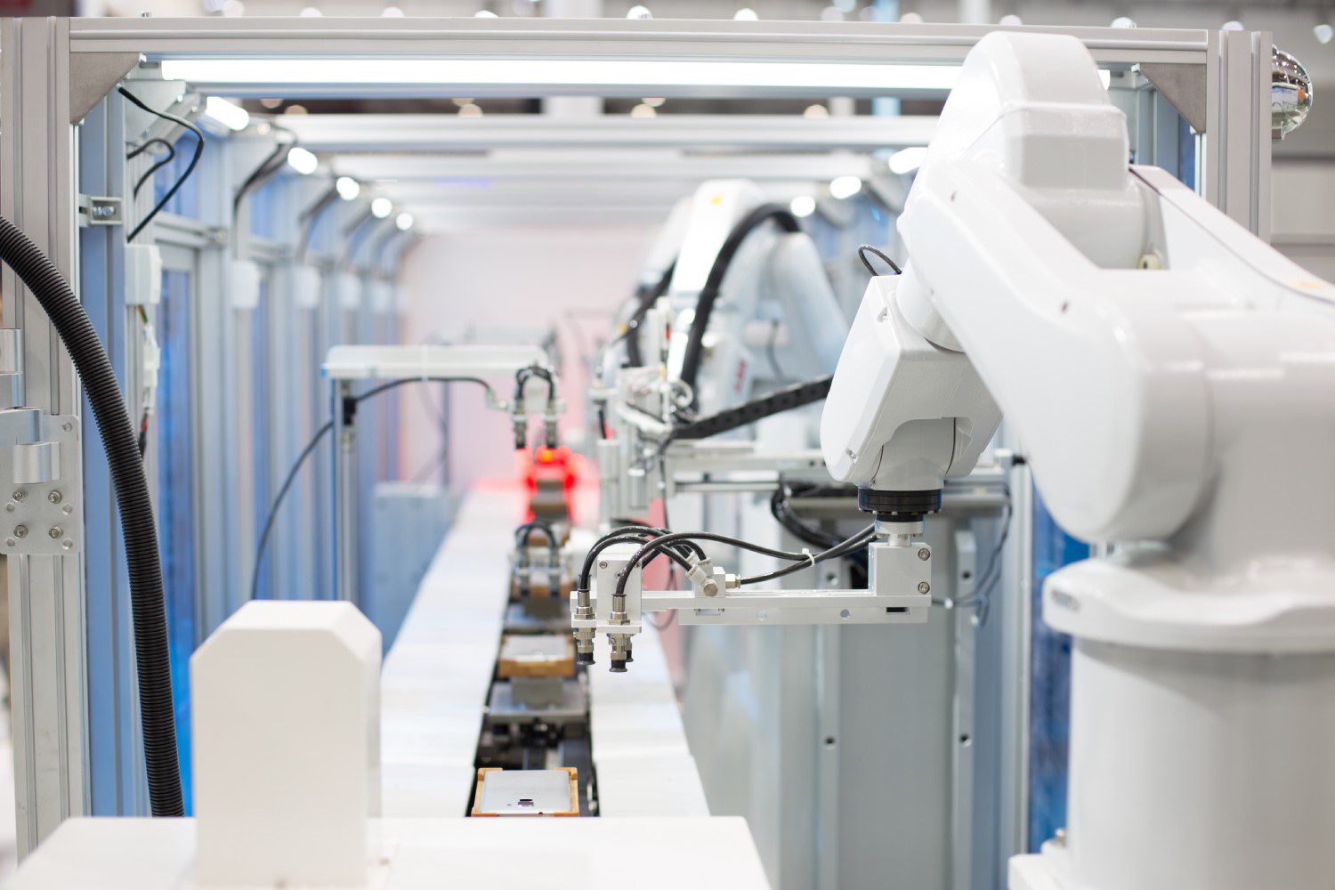 Robotic arms in a manufacturing facility.